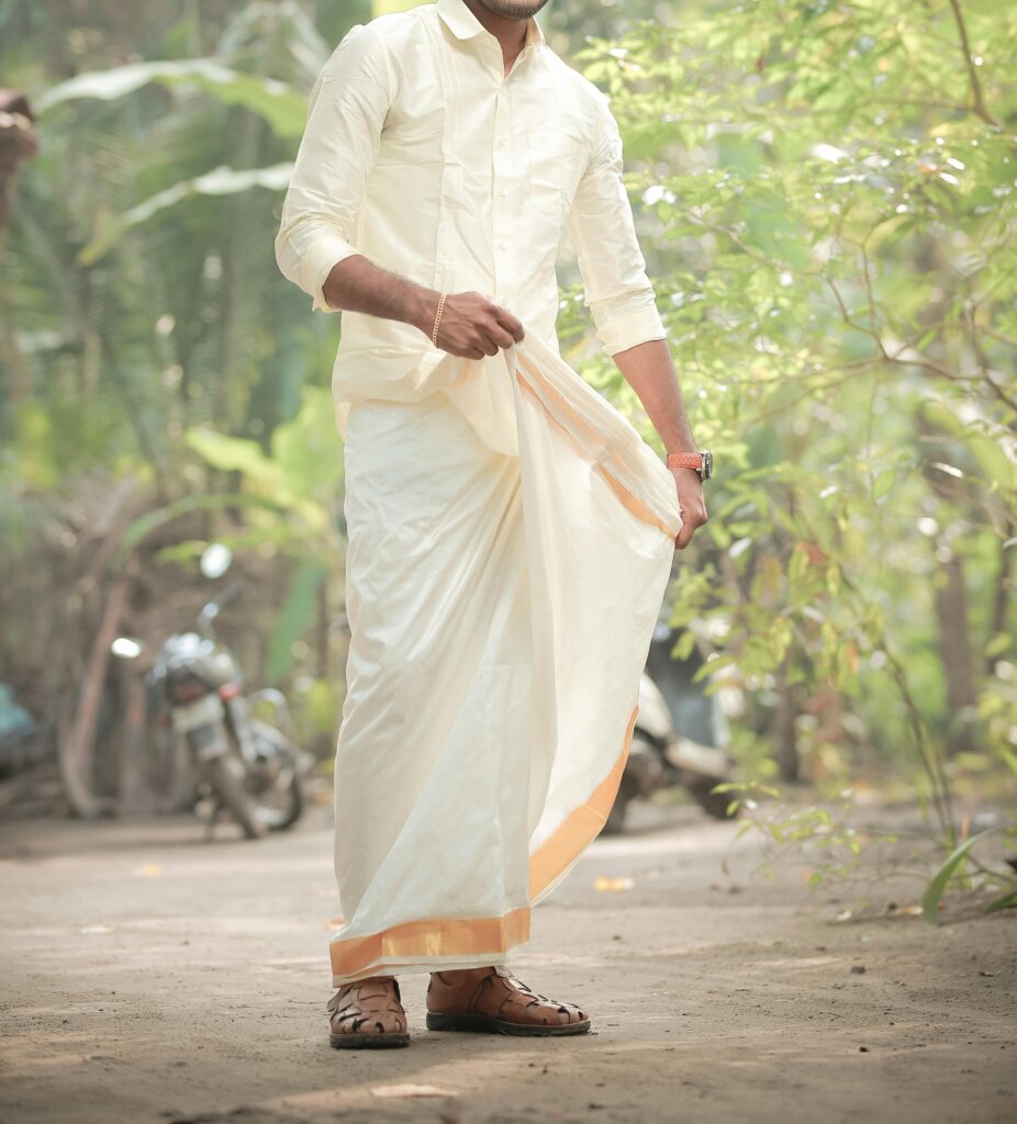 man in traditional dhoti wear and white shirt. Rich Culture and Traditions of South India.