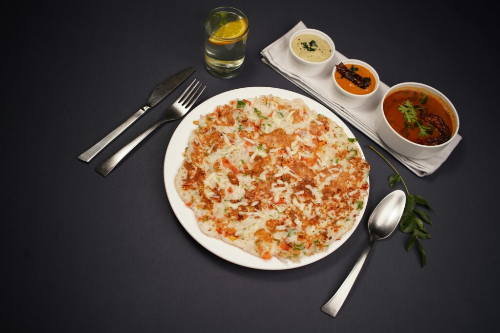 Delicious South Indian Uttapam served with chutneys.